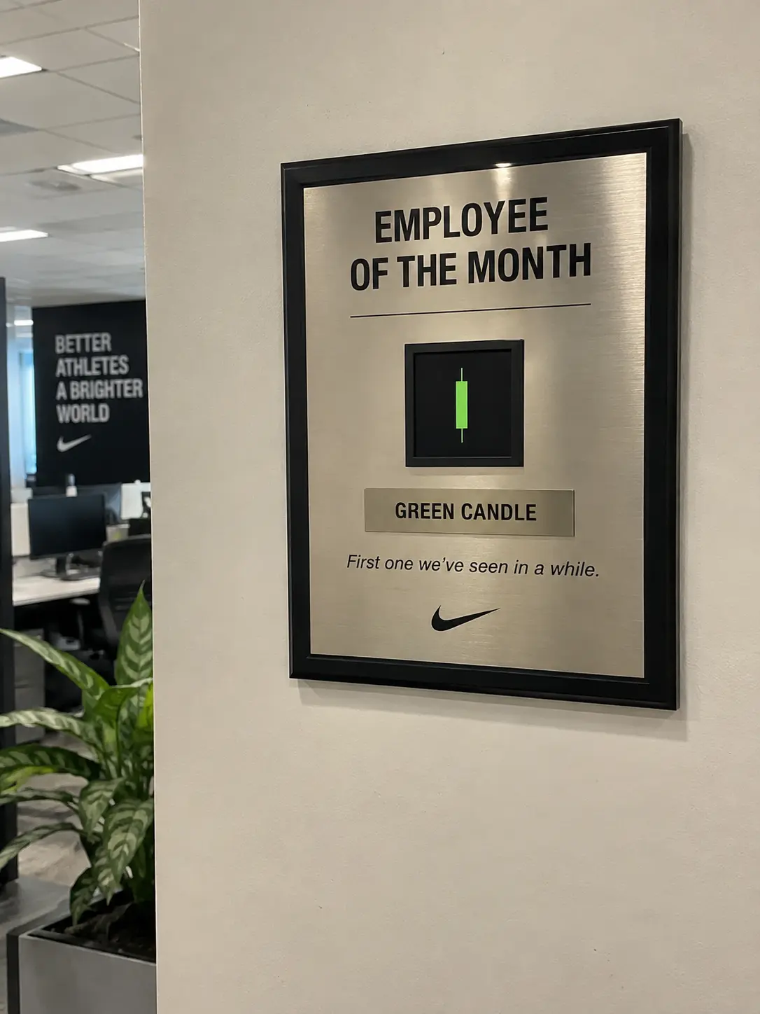 Employee of the month plaque awarded to a green candle